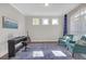 Inviting living room with natural light, hardwood floors, a piano, and comfortable seating arrangements at 319 Parkside Meadow Dr, Marietta, GA 30064