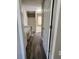 This bathroom features a single vanity, a tub-shower combo, and wood-look flooring at 4510 Swan Trce, Atlanta, GA 30349