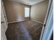 Cozy bedroom with plush carpeting offers a light-filled window and neutral tones throughout at 4510 Swan Trce, Atlanta, GA 30349