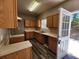 Bright and clean kitchen featuring light wood cabinets, neutral countertops, and new dark flooring at 4510 Swan Trce, Atlanta, GA 30349