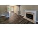 Beautiful living room featuring fireplace, arched doorways, and modern flooring throughout the home at 4510 Swan Trce, Atlanta, GA 30349