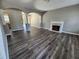 Spacious living room featuring fireplace, modern floors, and open layout with arched doorways at 4510 Swan Trce, Atlanta, GA 30349