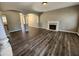 Spacious living room featuring modern floors, arched doorways and a fireplace with mantel at 4510 Swan Trce, Atlanta, GA 30349