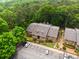 Aerial view of property highlighting parking, nearby trees, and multiple units at 605 Parkaire Xing, Marietta, GA 30068