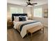 Tastefully decorated bedroom with a ceiling fan, neutral paint, carpet, and bright windows at 605 Parkaire Xing, Marietta, GA 30068
