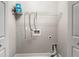 Convenient laundry hookups with shelf space for easy storage solutions at 605 Parkaire Xing, Marietta, GA 30068