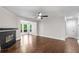 Open living room area with hardwood floors, natural light, and a fireplace for a warm and inviting atmosphere at 605 Parkaire Xing, Marietta, GA 30068