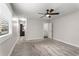 Bright main bedroom with ceiling fan and carpet floors, and an en suite bathroom nearby at 605 Parkaire Xing, Marietta, GA 30068