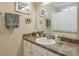 Well-lit bathroom with a vanity, mirror, and shower at 660 Delbridge Nw St, Atlanta, GA 30314
