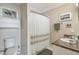 Bathroom featuring a shower with full curtain and a vanity at 660 Delbridge Nw St, Atlanta, GA 30314