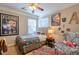 Bedroom with a ceiling fan and colorful decor at 660 Delbridge Nw St, Atlanta, GA 30314