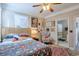 Bedroom with a ceiling fan, rug, and access to a bathroom at 660 Delbridge Nw St, Atlanta, GA 30314