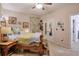 Well-lit bedroom featuring soft decor, wooden bed frame, and doorway to connecting room at 660 Delbridge Nw St, Atlanta, GA 30314