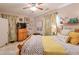 Bright bedroom featuring comfy bedding, wood dresser, and natural light from windows at 660 Delbridge Nw St, Atlanta, GA 30314