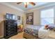 Bedroom with a ceiling fan and storage at 660 Delbridge Nw St, Atlanta, GA 30314