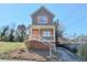 Inviting two-story home with a cozy front porch and well-maintained yard at 660 Delbridge Nw St, Atlanta, GA 30314