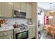 Charming kitchen with stainless steel appliances and granite counters at 660 Delbridge Nw St, Atlanta, GA 30314