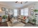 Bright living room featuring hardwood floors, neutral tones, and lots of natural light at 660 Delbridge Nw St, Atlanta, GA 30314