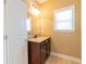 Bathroom with neutral walls, a vanity, and a window for natural light at 335 Roberts Run Cv, Suwanee, GA 30024