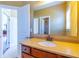 Bathroom boasts granite countertops, neutral walls, and seamless flow to other rooms at 335 Roberts Run Cv, Suwanee, GA 30024