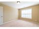 Bedroom with natural light and neutral walls and carpet at 335 Roberts Run Cv, Suwanee, GA 30024