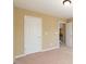 Neutral carpeted bedroom with neutral walls and white trim at 335 Roberts Run Cv, Suwanee, GA 30024