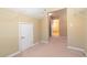 A closet with neutral walls, shelving, and carpeted flooring, providing ample storage space at 335 Roberts Run Cv, Suwanee, GA 30024