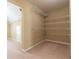 Spacious closet with multiple levels of wire shelving for storage and organization at 335 Roberts Run Cv, Suwanee, GA 30024