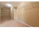 A well-organized walk-in closet with multiple shelving units and ample storage space at 335 Roberts Run Cv, Suwanee, GA 30024