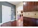 Dining area features hardwood floors and a chalkboard wall for creative expression at 335 Roberts Run Cv, Suwanee, GA 30024