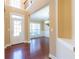 Inviting foyer features gleaming hardwood floors, a chandelier, and a welcoming entryway at 335 Roberts Run Cv, Suwanee, GA 30024