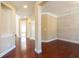 Open-concept living area featuring hardwood floors, neutral tones, and decorative accents at 335 Roberts Run Cv, Suwanee, GA 30024