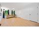 Finished basement area with light hardwood floors, natural light, and neutral decor at 3964 Gretna Green Dr, Decatur, GA 30035