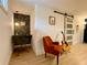 Finished basement with stylish office nook, barn door, and comfortable seating area, perfect for relaxation at 3964 Gretna Green Dr, Decatur, GA 30035