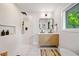 Modern bathroom featuring a walk-in shower, natural light and a double vanity at 3964 Gretna Green Dr, Decatur, GA 30035