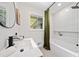 Modern bathroom featuring a stylish vanity, sleek fixtures, and a shower-tub combo with unique tile at 3964 Gretna Green Dr, Decatur, GA 30035