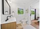 Tastefully designed bathroom with a large mirror, natural light and an en-suite bathroom at 3964 Gretna Green Dr, Decatur, GA 30035