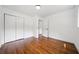 Cozy bedroom with hardwood floors, closet, and minimalist decor, providing a serene living space at 3964 Gretna Green Dr, Decatur, GA 30035