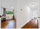 Hallway leading to a bright office with hardwood flooring and large window at 3964 Gretna Green Dr, Decatur, GA 30035