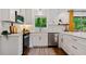 Well-lit kitchen boasting white cabinetry, modern stainless steel appliances, and an open window view at 3964 Gretna Green Dr, Decatur, GA 30035