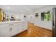 Updated kitchen boasts an island with quartz countertops, stainless steel appliances, and hardwood floors at 3964 Gretna Green Dr, Decatur, GA 30035