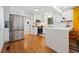 Eat-in kitchen features stainless steel appliances, white cabinets, hardwood floors, and bright, modern finishes at 3964 Gretna Green Dr, Decatur, GA 30035