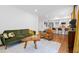 Bright living room featuring hardwood floors, modern furnishings, and seamless access to a well-equipped kitchen at 3964 Gretna Green Dr, Decatur, GA 30035