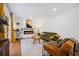 Cozy living room with modern fireplace, hardwood floors, stylish furniture, and large window letting in natural light at 3964 Gretna Green Dr, Decatur, GA 30035