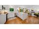 Bright open-concept space joining the kitchen and living room, showcasing modern finishes and hardwood floors at 3964 Gretna Green Dr, Decatur, GA 30035
