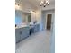 Luxurious bathroom with double vanity, marble floors, and modern fixtures at 4125 Sierra Vista Cir, Cumming, GA 30040