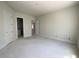 A spacious bedroom with two doors and a view into another room, awaiting personal design at 4125 Sierra Vista Cir, Cumming, GA 30040