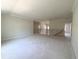 Spacious bonus room with neutral walls, trim, and dark wood staircase at 4125 Sierra Vista Cir, Cumming, GA 30040