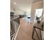 Bright living area with hardwood floors, complemented by an open view from the staircase and stylish decor at 4125 Sierra Vista Cir, Cumming, GA 30040