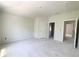 An unfinished room with bare floors and neutral walls, showcasing the potential for customization at 4125 Sierra Vista Cir, Cumming, GA 30040